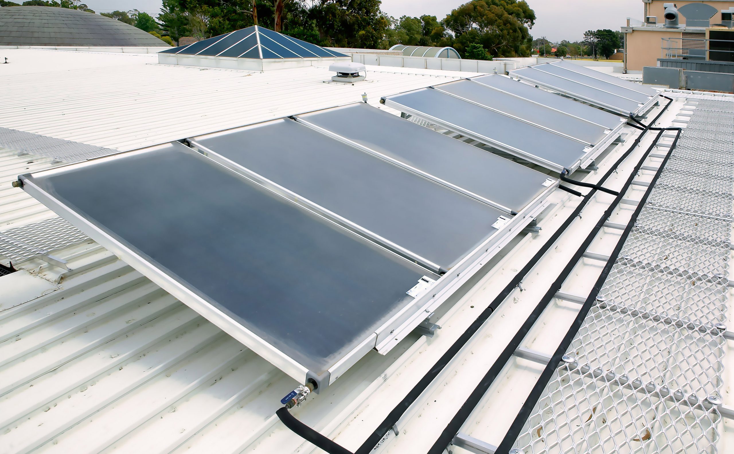 Rinnai Commercial Solar Pre-heat Flat Plate System (rooftop – left)